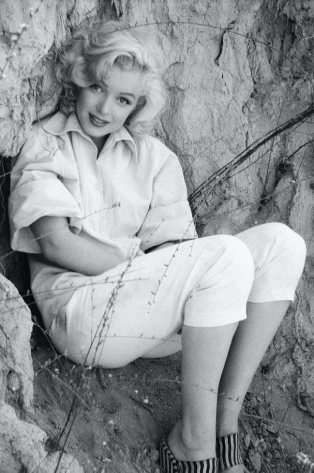 Marilyn Monroe in the ‘Rock Sitting’ Series Taken by Milton Greene for a Look Magazine, 1954.nam
